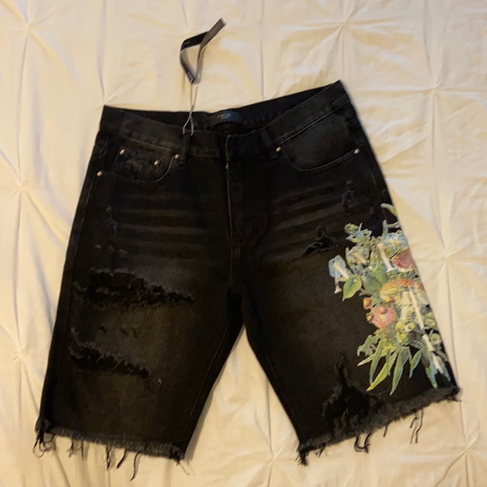 Black pair of Amiri Jean Shorts